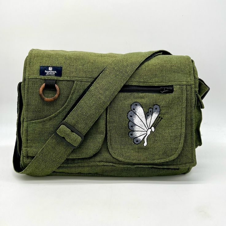 Butterfly Embroidered Laptop Bag It Looks Amazing Any Way You Wear It, Shoulder Or Crossbody! Suitable For Working Professionals And Students. Carry This Sporty, Yet Casual-Looking Laptop Bag Anywhere! Having Organizational Features Such As A Large Spacious Main Compartment And Various Pockets. Underneath The Velcro Flap Opening, You Will Find A Large Zipper-Closed Pocket. Within The Main Compartment, There Is Another Compartment For Your Valuables. In The Front, You Can Find Two Small-Sized Poc Rectangular Everyday Shoulder Bag With Embroidered Logo, Rectangular Shoulder Bag With Embroidered Logo For Everyday, Rectangular Shoulder Bag With Embroidered Logo, Travel Crossbody Bag With Embroidered Logo, Casual Travel Shoulder Bag With Embroidered Logo, Casual Shoulder Bag With Embroidered Logo For Travel, Embroidered Cotton Shoulder Bag For Travel, Casual Embroidered Shoulder Bag, Green Bag With Embroidered Logo For Everyday Use