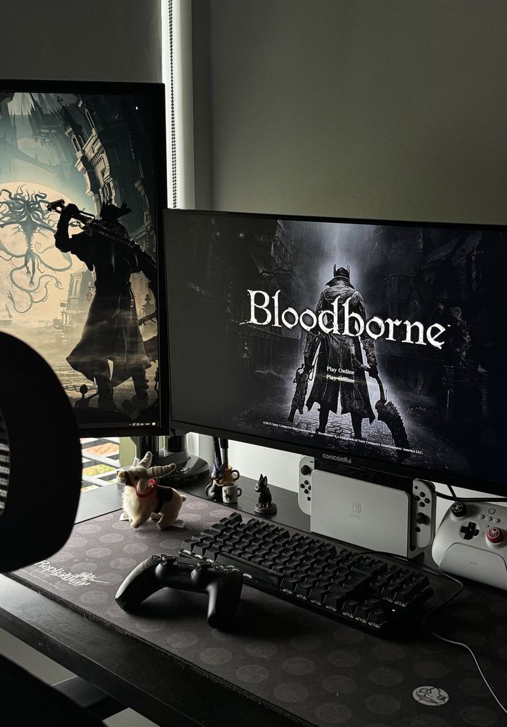 two computer monitors sitting on top of a desk next to a keyboard and mouse,