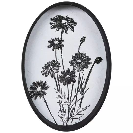 black and white photograph of flowers in oval frame