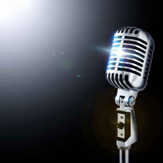 a silver microphone with the words train tradeskills radio on it and a black background