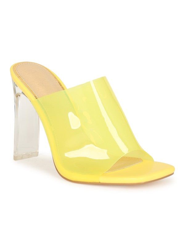 These gorgeous statement mules are a must have for every fashionista. Featuring a vibrant clear pvc detail and stacked heel for that sassy and classy look. Finished with a lightly padded insole and easy slide style.Material: PVC (man-made)Sole: Synthetic Measurement Heel Height: 4” (approx) Summer Party Slip-on Slides, Clear Sandals With Contrasting Heel For Spring, Spring Sandals With Contrasting Heel In Clear, Summer Party Pvc Heels, Summer Open Toe Pvc Heels, Trendy Transparent Strap Open Toe Heels, Trendy Open Toe Heels With Transparent Straps, Spring Clear High Heel Jelly Sandals, Spring High Heel Jelly Sandals With Clear Strap