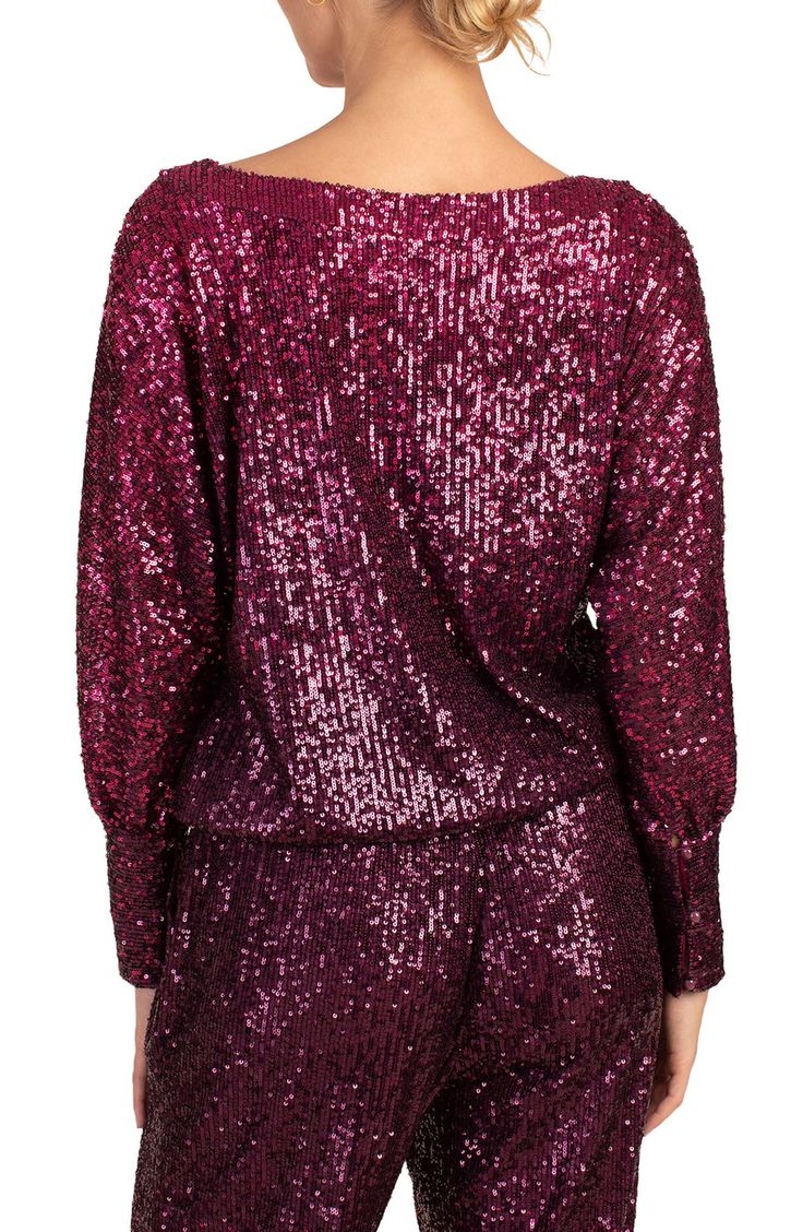 Take your look to glam new heights with this dolman-sleeve top covered in shimmery sequins. Boat neck Long sleeves 95% polyester, 5% spandex Dry clean Imported Glamorous Fall Top With Contrast Sequin, Glamorous Contrast Sequin Top For Fall, Glamorous Fall Tops With Contrast Sequin, Glamorous Long Sleeve Tops With Contrast Sequin, Glamorous Long Sleeve Glitter Tops, Glamorous Contrast Sequin Tops For Holidays, Glamorous Holiday Tops With Contrast Sequin, Pink Glamorous Top With Contrast Sequin, Pink Glamorous Tops With Contrast Sequin