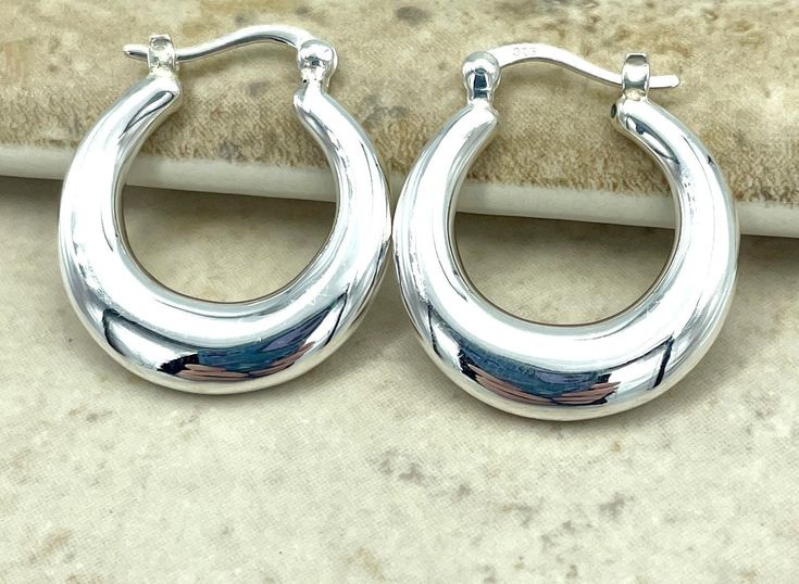 Elevate your style with these timeless classics: the 925 Sterling Silver Hoop Earrings. Their simple latch-back design ensures a secure and comfortable fit, while the lightweight, hollow structure provides effortless elegance without weighing you down. Each earring is meticulously stamped with '925' to guarantee its authenticity and premium quality. Perfect for any occasion, these hoops will add a touch of sophistication to your ensemble. Satisfaction Guaranteed! Sterling Silver Hoop Earrings, Effortless Elegance, Sterling Silver Hoops, Jewelry Earrings Hoops, Silver Hoops, Birthday Present, Silver Hoop Earrings, Ideal Gift, Silver Jewelry