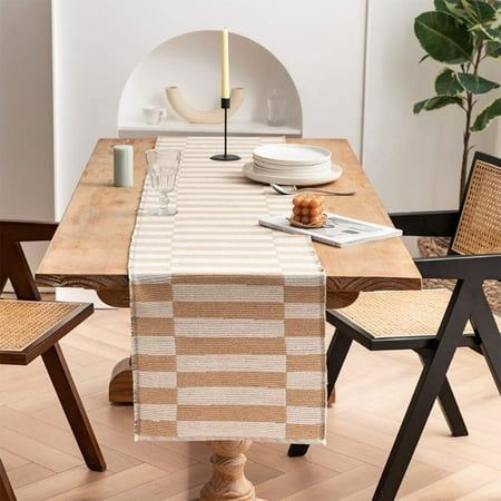 a dining room table set with place settings