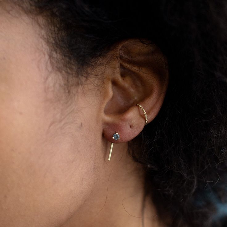 something blue or pretty in peach? Ethically + domestically-sourced gemstones are the perfect pop of color in these simple, stackable thread earrings. Choose from blue Sapphires from Montana or peachy-pink Sunstones from Oregon, and make them your own in the metal of your choice! Earring Specifications: brilliant-cut Montana sapphires each weigh .25ct + measure 3mm brilliant-cut Oregon peach sunstones each weigh .20ct + measure 3mm stones are prong-set in the metal of your choice thread measures Everyday Single Ear Climber Fine Jewelry, Minimalist 14k Gold Earrings With Gemstone, Minimalist Birthstone Earrings, Minimalist Birthstone Earrings For Everyday, Minimalist Everyday Earrings With Birthstone, Montana Sapphires, Thread Earrings, Montana Sapphire, Peachy Pink