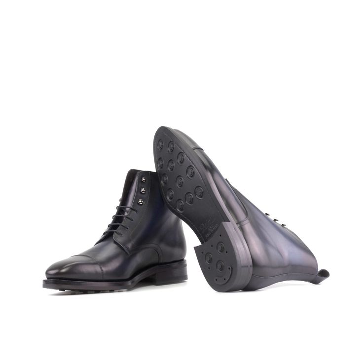 The perfect blend of dressy and casual, the Jumper boot is a higher leg derby boot with a straight toe cap. They will add some hardy, military-inspired style to your wardrobe. The classic cap-toe gives them an elegant look, while the speed hooks add a rugged edge. The Details: Materials: navy box calf Sole: black original Dainite® rubber sole with higher heel Last: Savile - Sleek looking aesthetic with slight chisel toe What is Fast Lane? Fast lane is our new experimental 7 day made to order col Classic Fitted Goodyear Welted Moto Boots, Business Lace-up Boots With Cap Toe For Winter, Classic Goodyear Welted Combat Boots With Moc Toe, Classic Goodyear Welted Moc Toe Combat Boots, Classic Goodyear Welted Work Boots For Winter, Classic Goodyear Welted Moto Boots For Work, Classic Business Moto Boots With Goodyear Welt, Classic Combat Boots With Goodyear Welted Construction, Classic Combat Boots With Goodyear Welted