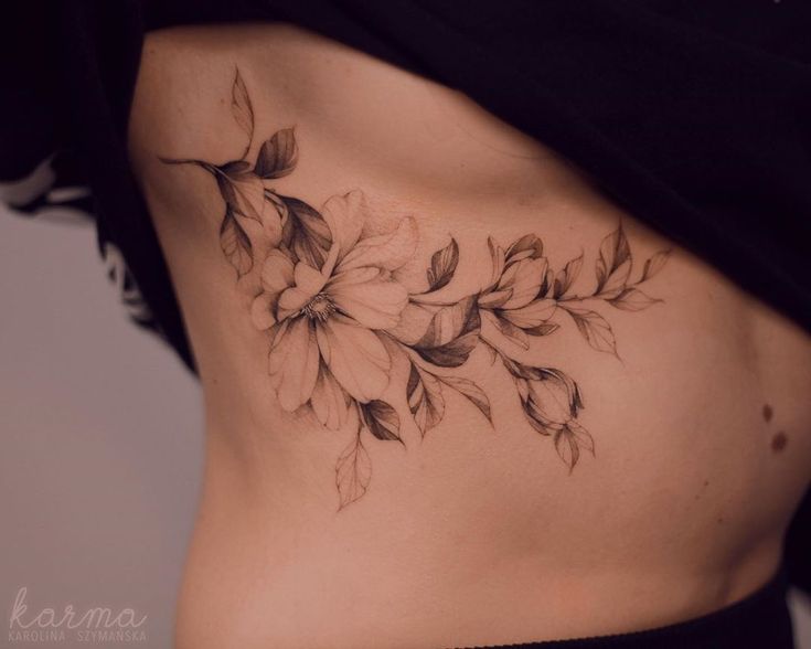 a woman's stomach with flowers on it