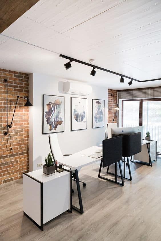 a living room filled with furniture next to a brick wall covered in pictures and lights