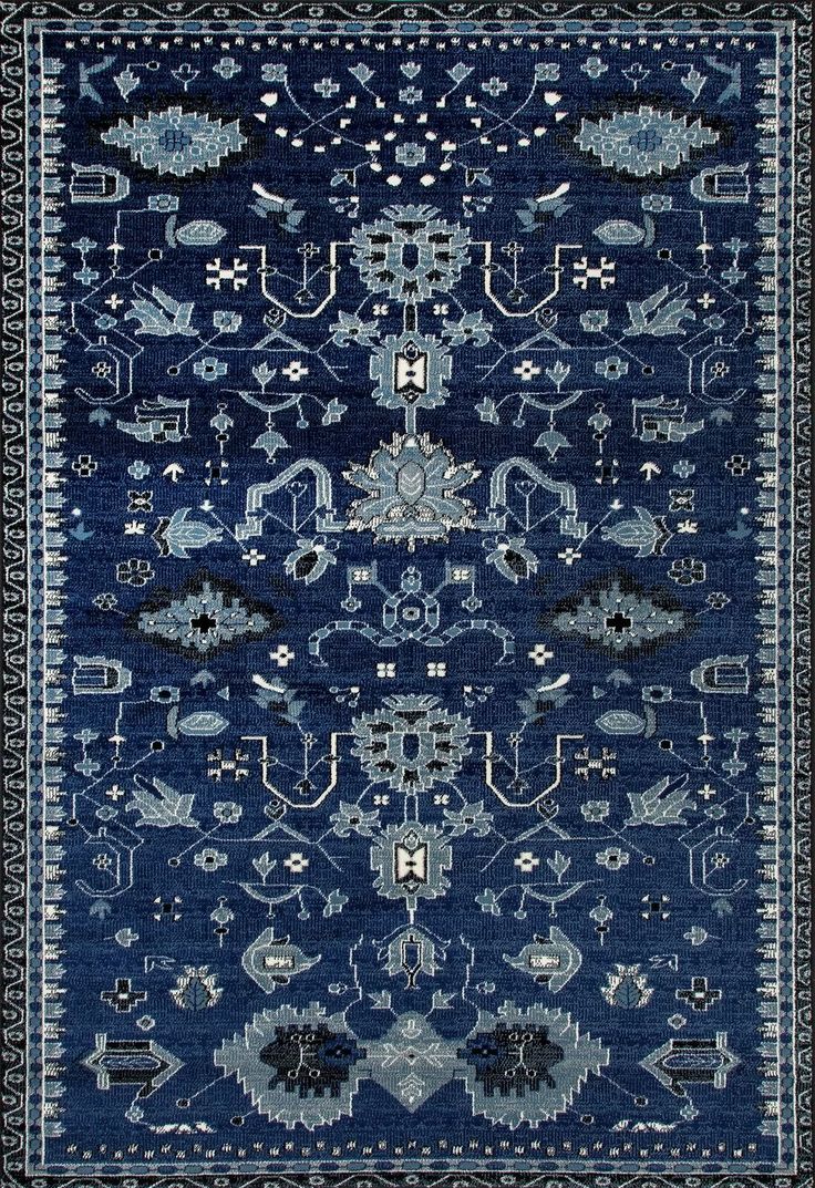 a blue rug with an intricate design on it