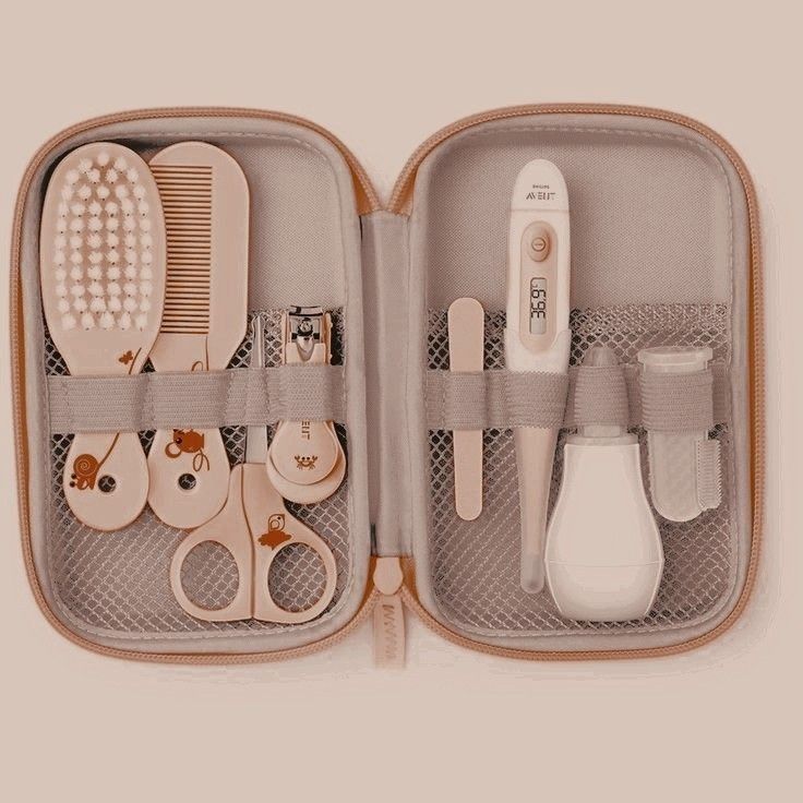 an open case with various items in it that include scissors, combs and hair clips