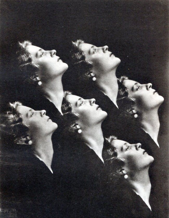 an old black and white photo of five women with their heads tilted in the air