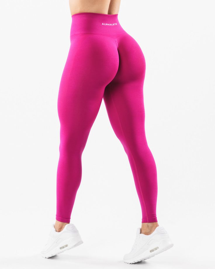 HIGHLIGHTS. High-waisted legging 3-tiered tapered waistband. Seamless, knit fabric. No front seam. Back scrunch seam detail to enhance curves. Leg and glute contouring panels. ForeverKnit core logo on waistband FIT SUGGESTION. This item runs true to Alphalete’s standard seamless fit.. If you are between sizes, we recommend sizing up.. Model is 5’4”/162.5cm, wearing a size XS with a 26”/66cm waist and 39.5”/100.3cm hips. MATERIALS AND WASHING DIRECTIONS. 51% Polyamide, 38% Polyester, 11% Elastane Amplify Leggings, Gym Girlie, Lifting Leggings, Scrunch Leggings, Workout Style, Pink Leggings, Seamless Leggings, Bottom Clothes, High Waisted Leggings