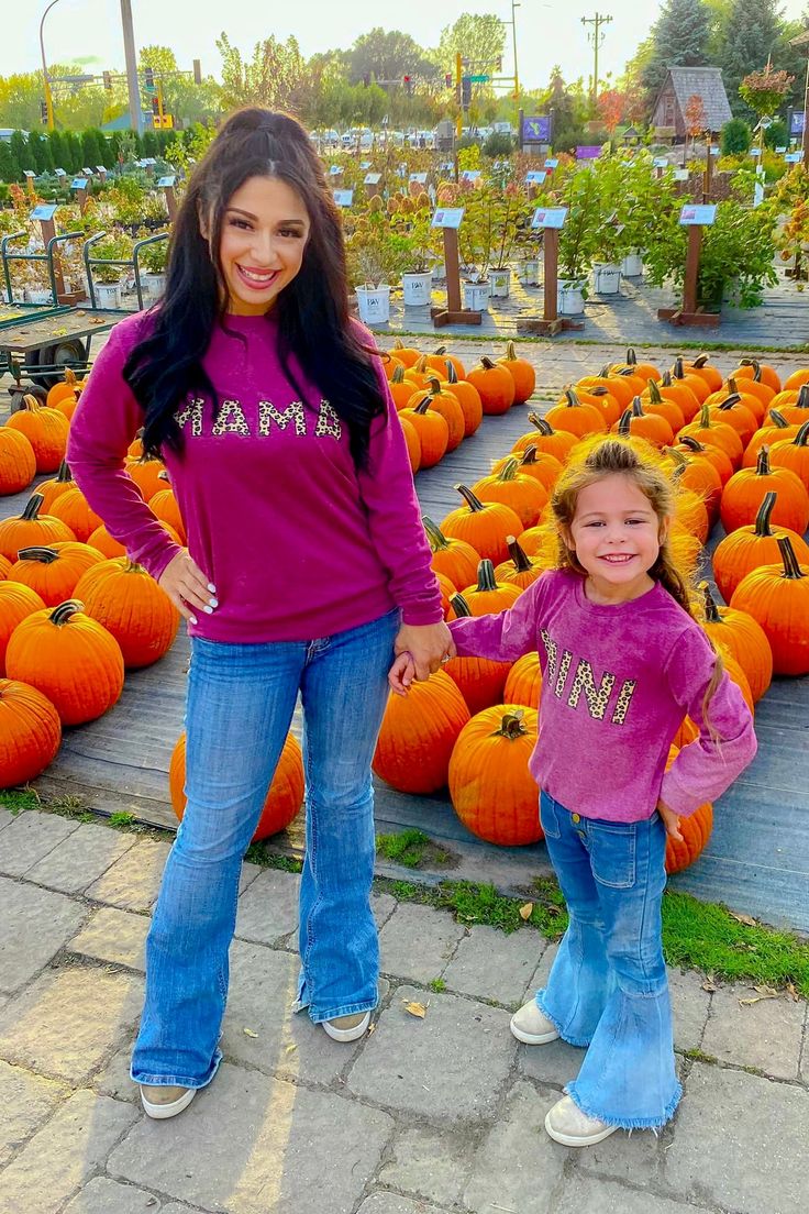 *Each top sold separately* Mom & me tops feature longer sleeves perfect for cool weather wear Long sleeve shirts feature a raspberry rose design Mom top reads "Mama" and child top reads "Mini" Ultra soft material for comfort & ease all season long Twinning is winning! Match with your little one in our "Mama & Mini" Raspberry Rose Tops. These tops feature long sleeves and a fun mama and mini saying embossed on the front. In a versatile design, this top is made from soft and breathable fabric that Family Matching Pink Tops For Fall, Spring Family Matching Long Sleeve Tops, Family Matching Long Sleeve Tops For Spring, Purple Relaxed Fit Top For Fall, Matching Cotton Sweatshirt For Fall, Purple Letter Print Top For Fall, Pink T-shirt For Fall, Long Sleeve Tops With Letter Print, Cotton Fall Sweatshirt