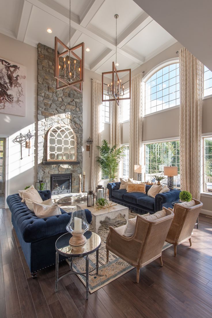 a living room filled with furniture and windows