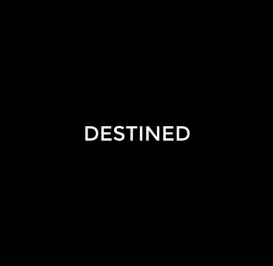 a black background with the word destined written in white on it's left side