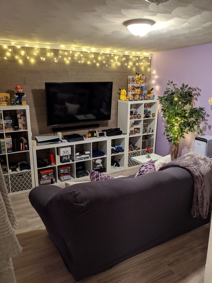 a living room filled with furniture and a flat screen tv