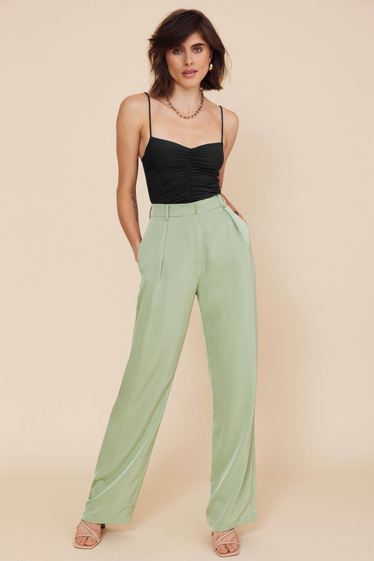 DETAILS Fuss-free trousers that are as trendy as they are comfy. The Andie flared pants have a glossy satin finish, and it’s a versatile piece that can be dressed up or down depending on the occasion. Length: Long Easy fit Unlined Belt loops included Front button Side pockets Color: Sage GreenComposition: Polyester SIZE & FIT Full Size Guide Model wears a AU 8 / US 4 / Size S Height: 173cm / 5'8'' Bust: 84cm / 33'' Waist: 64cm / 25'' Hips: 89cm / 35'' *** PLEASE NOTE*** The Lakeyo clothing range runs half a size smaller than standard AU clothing sizes, please consider the size before purchase, thank you! Evening Viscose Trousers, Viscose Evening Trousers, Chic Evening Pants In Viscose, Party Satin Straight Pants, Party Straight Satin Pants, Sleek Satin Wide Leg Pants, Green Wide Leg Viscose Bottoms, Chic Solid Viscose Pants, Chic Evening Bottoms In Viscose