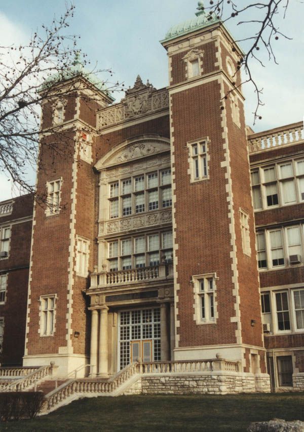 an old brick building with stairs leading up to it