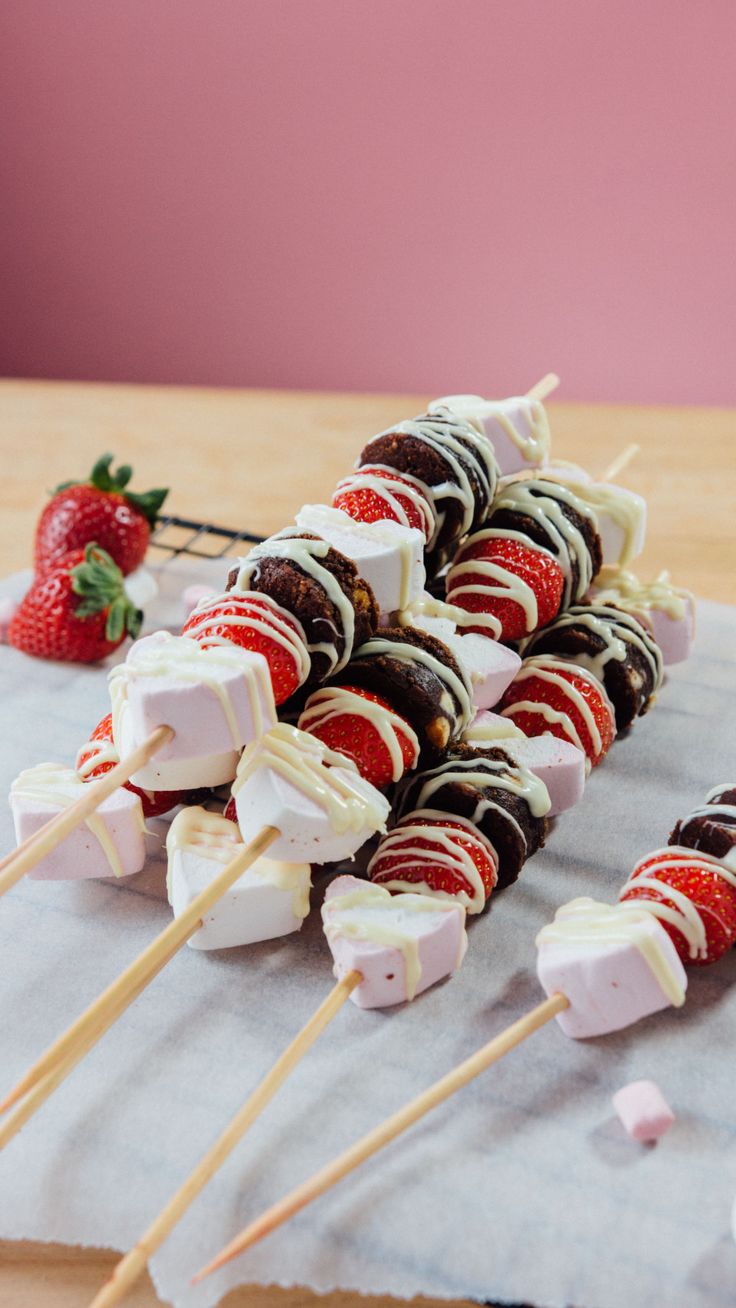 chocolate covered strawberries and marshmallows on sticks