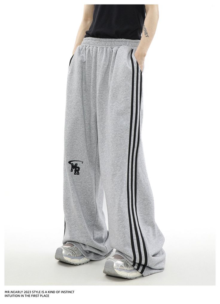 Urban Edge Athleisure Tracksuit - chiclara Baggy Tracksuit Pants, Casual Relaxed Fit Sweatpants With Three Stripes, Urban Gray Joggers For Sports, Urban Style Gray Joggers For Sports, Sporty Gray Tracksuit With Pockets, Gray Relaxed Fit Sportswear Tracksuit, Gray Relaxed Fit Sporty Tracksuit, Sporty Gray Relaxed Fit Tracksuit, Gray Cotton Tracksuit For Leisure