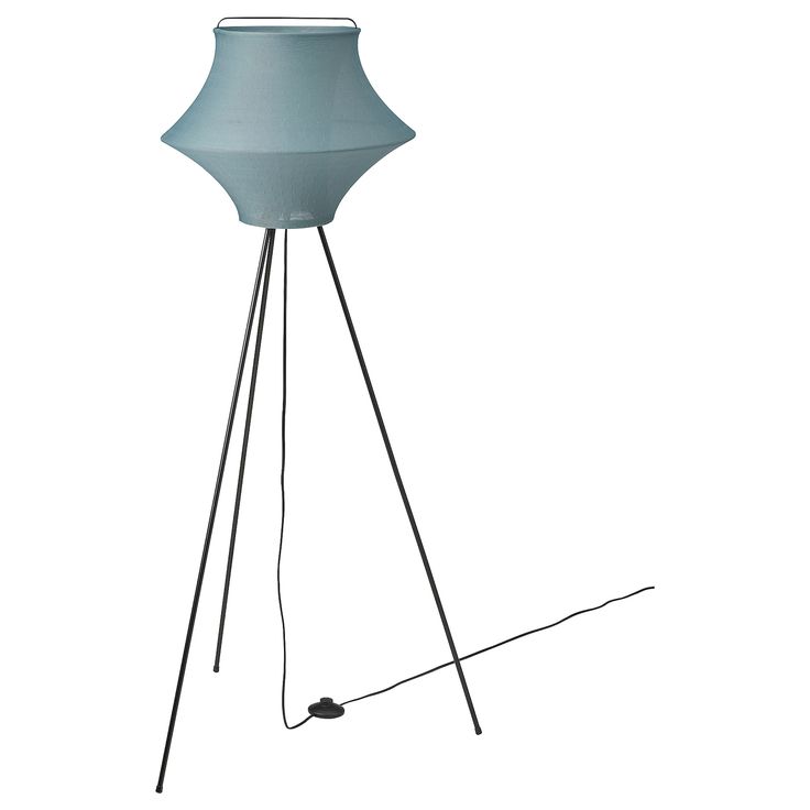 a floor lamp with a blue shade on the top and two black legs in front