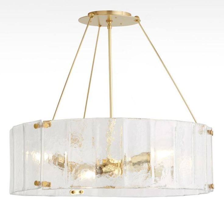 a chandelier with clear glass and gold accents