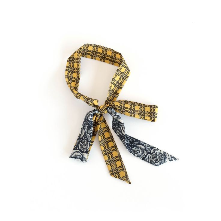 "Small skinny scarf in yellow and black bold plaid/woodcut rose. Ready to ship, special edition midi-length skinny scarf designed by Cinne. Full of character with endless styling possibilities. Wear around your neck, in your hair, tied on your favorite bag, or around your wrist. Find more styling examples in second to last photo. Constructed entirely by hand with love and attention to every detail. . . . . . . . . . . . . . . . . . . . . . . . . . . . . . . . . . . . . . . . . . . . . . . . . . Silk Scarf With Ribbon For Gift, Trendy Scarf Neckwear As Gift, Chic Scarves With Ties, Chic Adjustable Scarves With Ties, Elegant Yellow Scarves As Gift, Elegant Yellow Scarves For Gifts, Chic Neckwear Ties As Gift, Elegant Yellow Scarves For Gift, Elegant Yellow Scarf As Gift