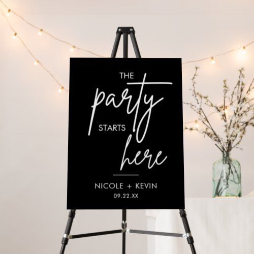 the party starts here sign is on an easel next to a vase with flowers