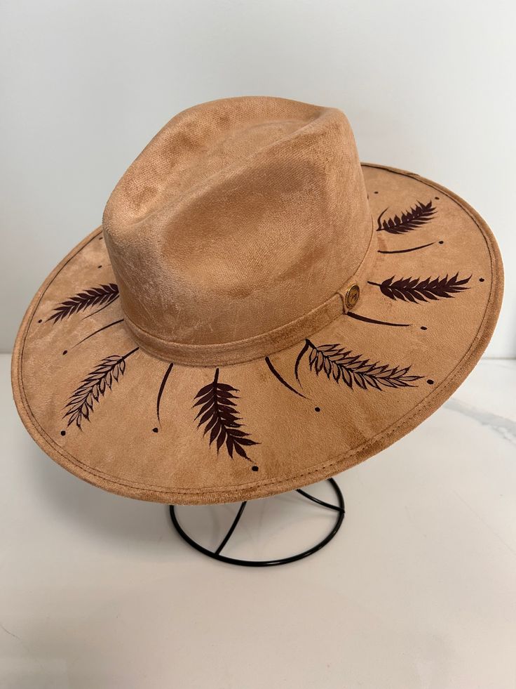 A truly unique style and look with hand painted detail. This hat is hand painted and hand crafted by artisans in Mexico. Unique Brown Fedora With Flat Brim, Handmade Brown Felt Hat With Curved Brim, Unique Brown Fedora With Curved Brim, Handmade Brown Fedora With Short Brim, Handmade Brown Fedora With Curved Brim, Brown Handmade Fedora With Short Brim, Handmade Brown Fedora For Fall, Handmade Brown Artisan Fedora, Artisan Hand Painted Adjustable Hat Bands