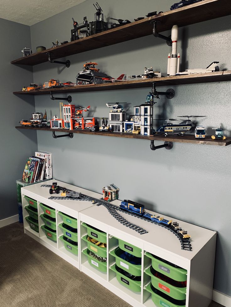 a room with shelves filled with toy cars and toys on top of each shelf in front of the wall