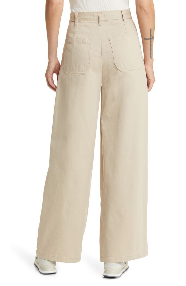 Crisp front pleats and a high waist add to the charm of these cotton wide-leg pants that easily take your look from day to night. 31" inseam; 25" leg opening; 12 1/2" front rise; 17" back rise (size 29) Zip fly with hook-and-bar closure Front slant pockets; back patch pockets 100% cotton Machine wash, line dry Imported 100% Cotton Clothing Women, Pacsun Pants, Cotton Cargo Pants, High Waist Wide Leg Pants, Perfect Wardrobe, Cargo Pants Women, Flare Pants, Pacsun, Leg Pants