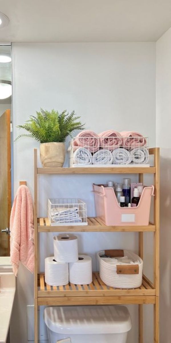 the bathroom is clean and ready to be used as a storage area for toiletries