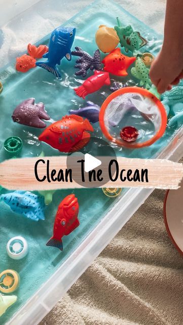 a child is playing with plastic toys in the water and on top of a table