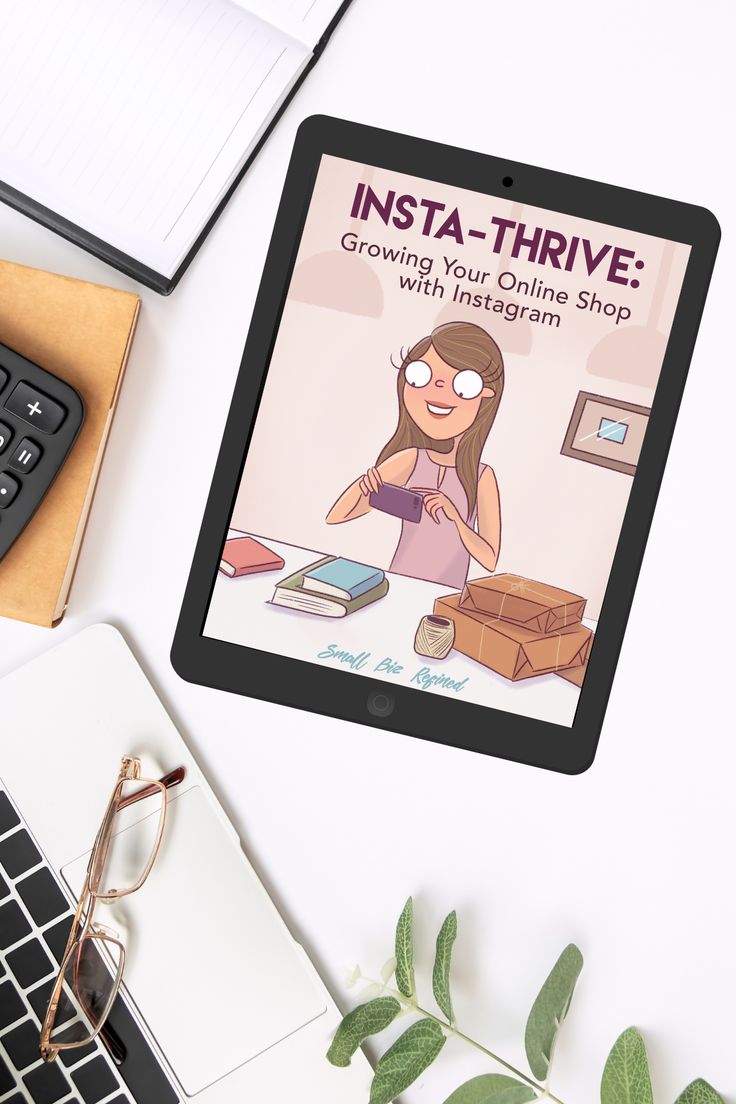 a tablet with an image of a woman sitting at a desk next to a keyboard