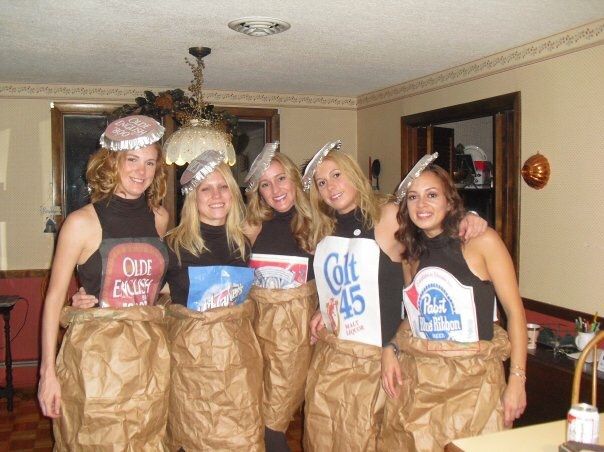 some girls are dressed up in paper bags