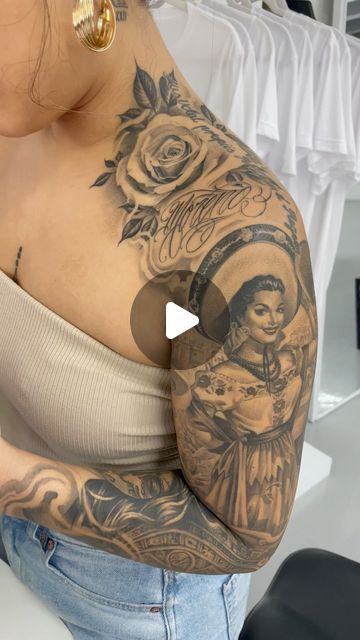 a woman with tattoos on her chest and arm