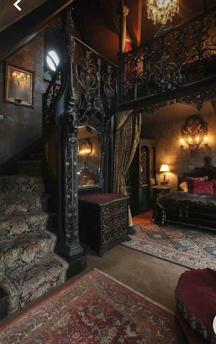 an ornate bed in the middle of a room with stairs and chandelier above it