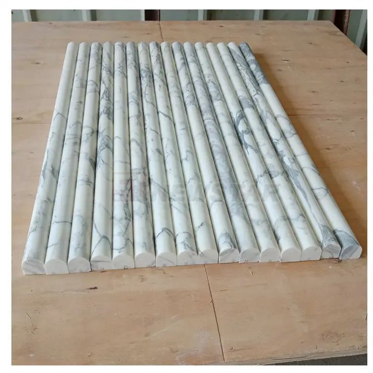 a large white marble tile on top of a wooden table