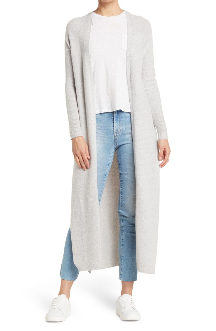 A knit duster jacket effortlessly layers over your look with it's longline fit. 49" length (size S) Open front Long sleeves Knit construction 75% acrylic, 22% nylon, 3% spandex Hand wash, dry flat Imported Model stats: 5'10" height, 32" bust, 25" waist, 36" hip. Model is wearing size S Long Sweater Coat For Winter, Versatile Knit Outerwear With Relaxed Fit, Long Knit Sweater Coat In Solid Color, Gray Long Soft Knit Outerwear, Long Knit Sweater Coat For Fall, Gray Stretch Outerwear For Fall, Stretch Gray Outerwear For Fall, Cozy Long Outerwear For Layering, Cozy Long Spring Outerwear