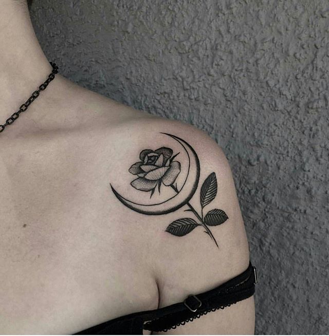 a woman with a rose tattoo on her shoulder