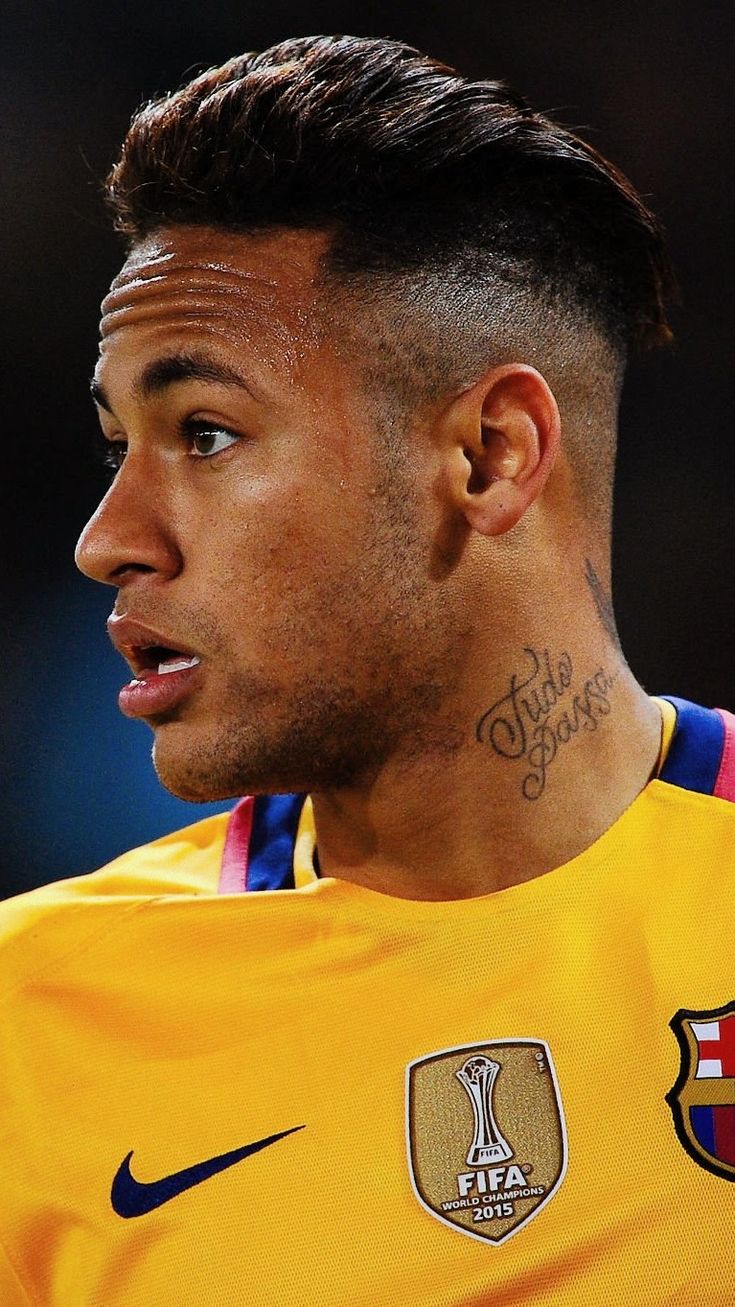 a soccer player with tattoos on his face