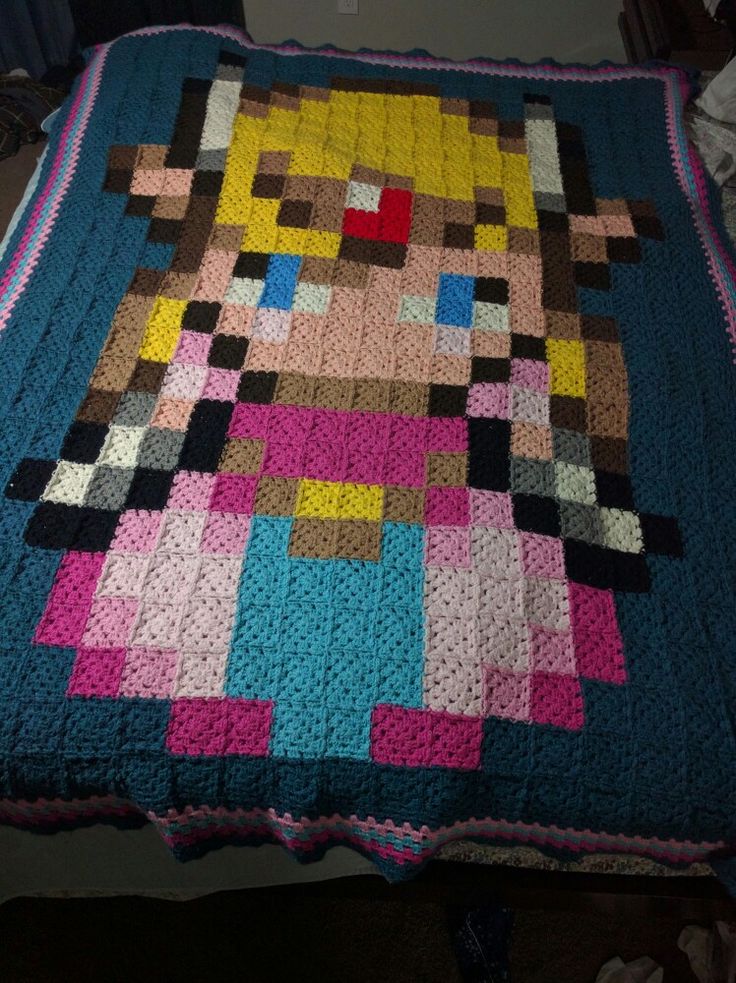 a blanket made to look like an old video game character