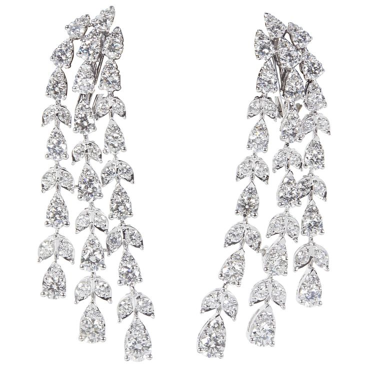 A stunning pair of earrings! Almost 7 carats of sparkle! 6.87 carats of round brilliant cut diamonds set in pear and marquise shaped 18k white gold. The round stones give the earrings more sparkle and a unique look. Approximately half an inch wide and 2 inches at its longest point Please contact us for more information. Pearl Chandelier Earrings, Diamond Chandelier Earrings, Gem Earrings, Diamond Dangle Earrings, Sparkle Jewelry, Expensive Jewelry, Diamond Drops, Antique Earrings, Lovely Jewellery