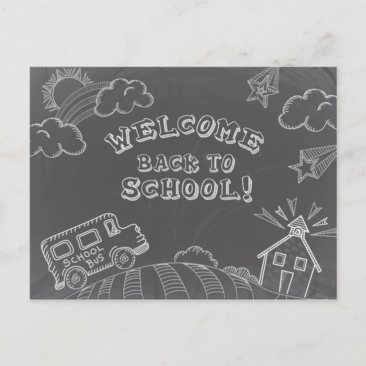 a chalkboard with the words welcome back to school written on it