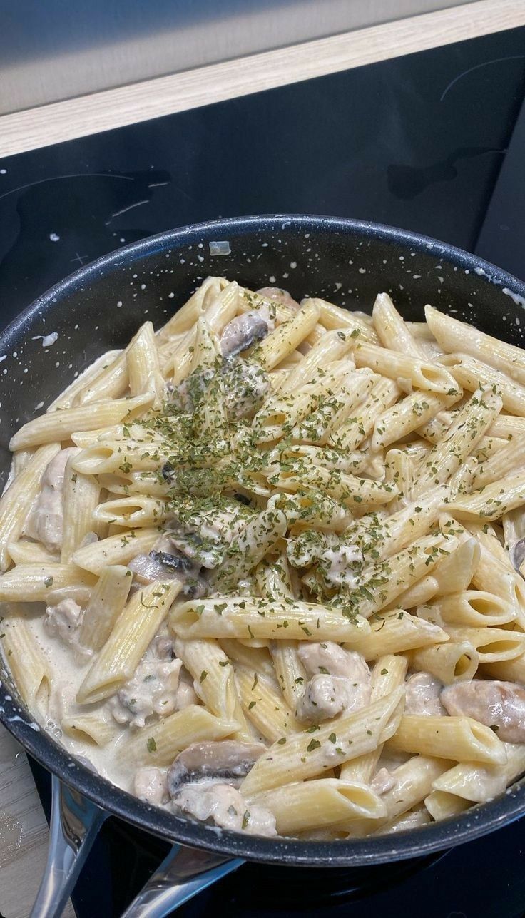 a pan filled with pasta covered in sauce