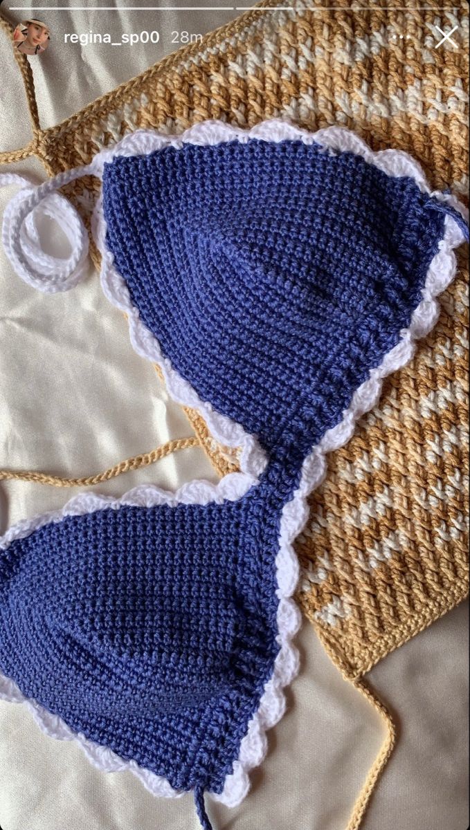 two crocheted swimsuits are laying next to each other