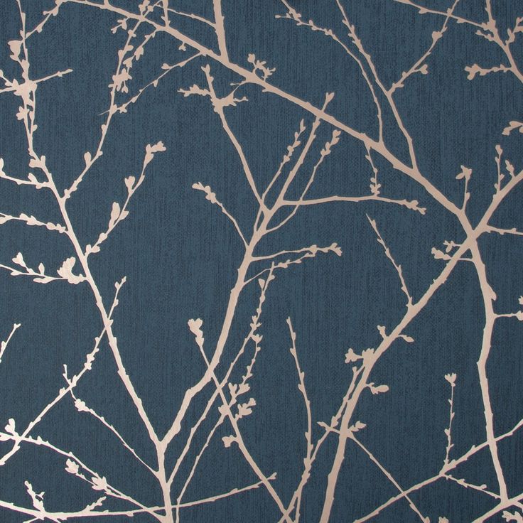 the branches of a tree against a dark blue wallpaper with white leaves on it