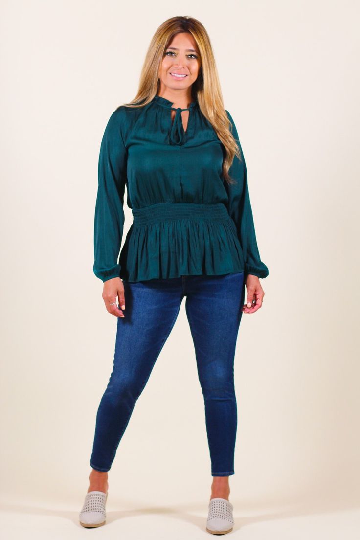 Chic long-sleeve blouse featuring smocked waist and subtle ruffled details. -Color: Hunter Green -Content: 100% Polyester -Imported -Runs true to size -Model is 5'5" 36-30-40 and wearing a size Small Chic Fall Blouse With Smocked Bodice, Spring Long Sleeve Blouse With Smocked Bodice, Chic Peasant Top With Smocked Cuffs For Fall, Long Sleeve Blouse With Smocked Bodice For Spring, Casual Smocked Blouse For Fall, Chic Long Sleeve Smocked Top For Work, Chic Long Sleeve Blouse With Smocked Bodice, Long Sleeve Blouse With Smocked Bodice For Fall, Chic Fall Peasant Top With Smocked Cuffs