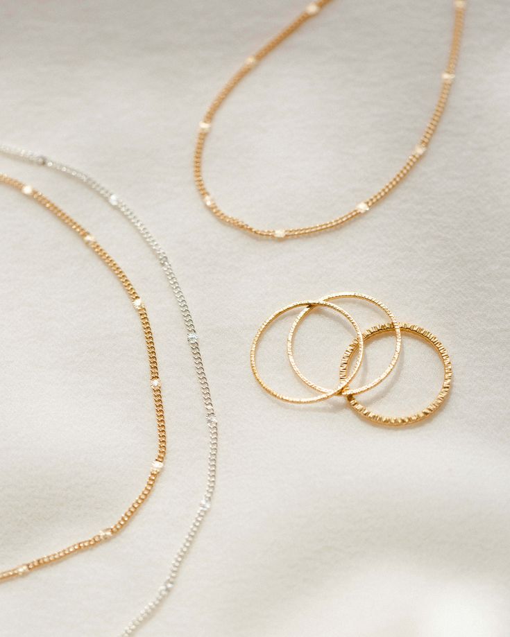 The anklet that shines like summer incarnate. Each chain is dotted with little sunbursts to catch the light — like fireflies, twinkling lights and golden hour all rolled into one! Style it solo, stack with your favorite anklets or add a charm for an extra sparkle of personalization. Want to shine even brighter? Check out the full Radiant Collection. Gold Stackable Jewelry For Summer, Gold Stackable Summer Jewelry, Summer Gold Stackable Jewelry, Gold Jewelry With Tiny Beads For Summer, Dainty Gold Anklets For Festivals, Summer Gold Jewelry With Tiny Beads, Twinkling Lights, Chain Anklet, Digital Gifts