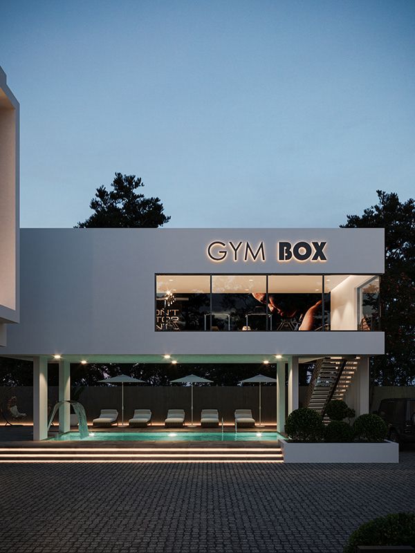 a white building with stairs leading up to it and the words gym box on top